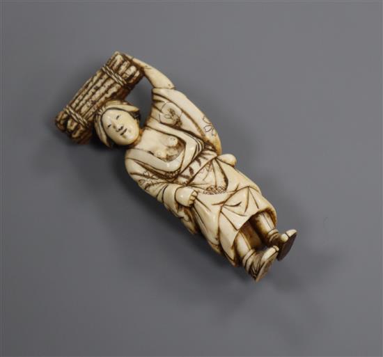 A Japanese ivory netsuke of a lady, Meiji period, two character signature 6.4cm